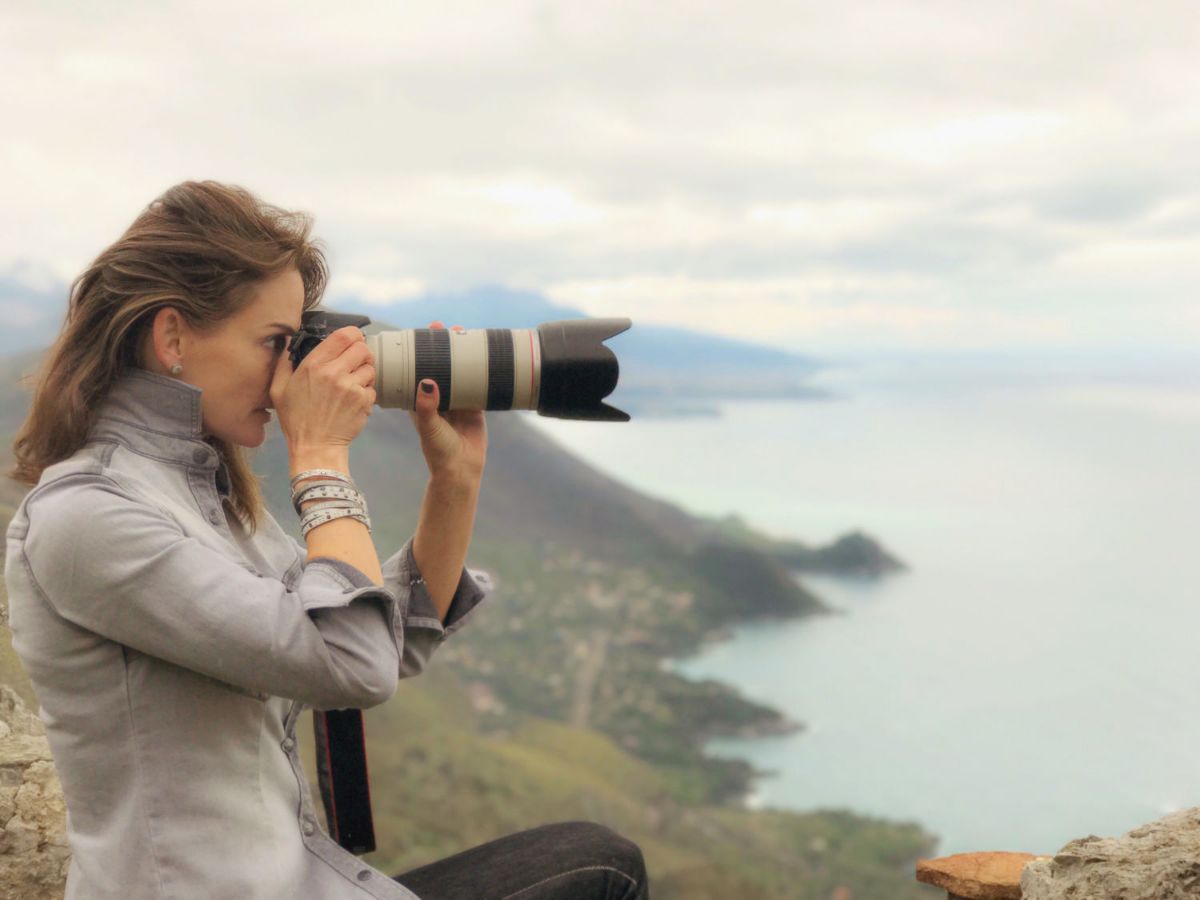 J. Alix Barber photographing a coastline