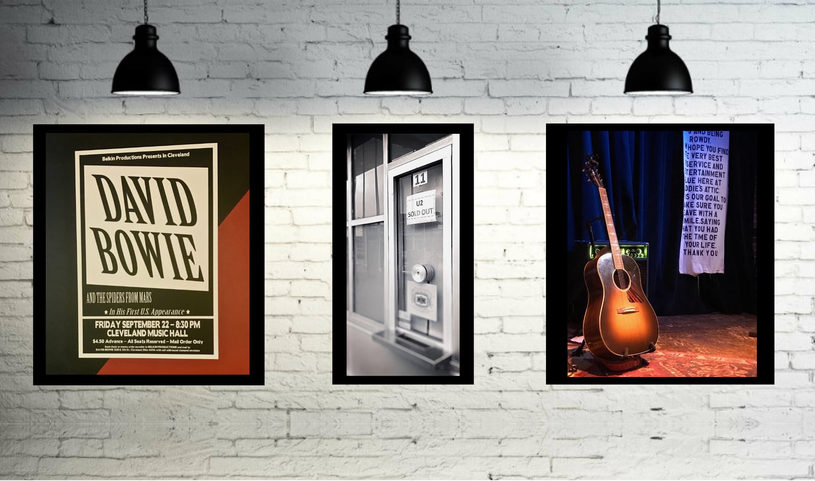 Three framed music photographs, one of David Bowie, on a white brick wall