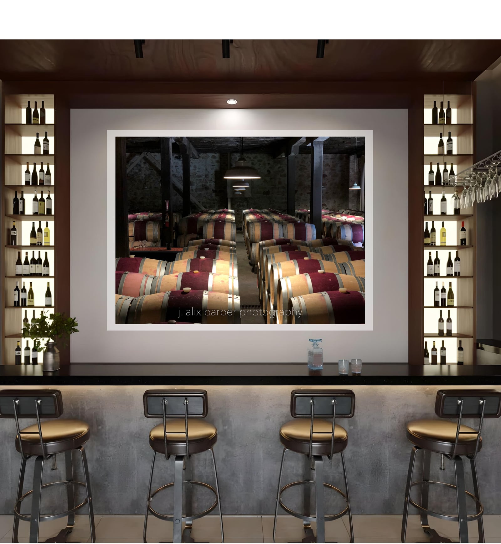 A wide framed photograph above a bar counter lined with stools
