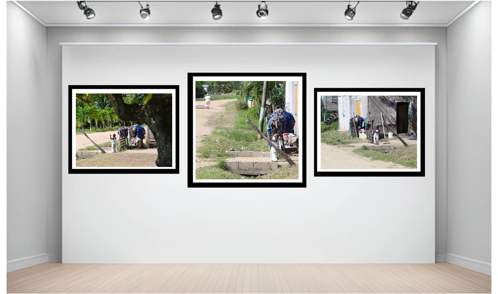 Three framed photographs hung as a triptych on a lit gallery wall