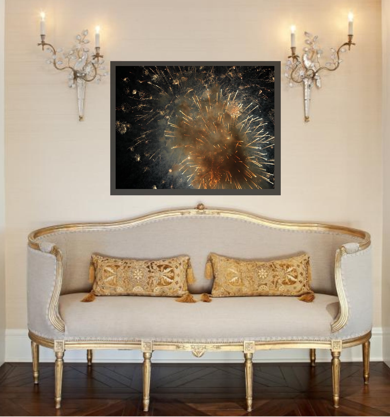 A framed golden burst photograph above an ornate cream settee between sconces